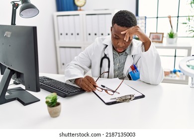 Young African Man Stressed Working As Doctor At Medical Clinic