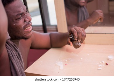 A Young African Man Taking Harmful Substance, Drug Abuse.