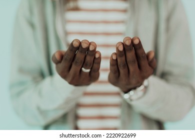 Young African Muslim Man Making Traditional Fatiha Prayer To Allah - Powered by Shutterstock