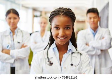 Young African Nurse In Medical Apprenticeship Smiling Friendly