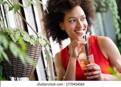 Young african woman enjoy healthy vegetarian smoothie for weight loss