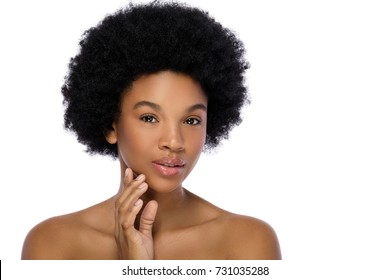 Young African woman with a perfect skin on white background