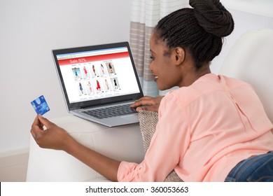 Young African Woman Shopping Online With Debit Card