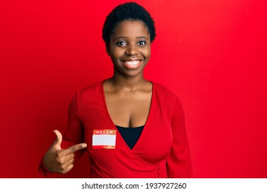 Young African Woman With Short Hair Wearing Hello My Name Is Sticker Identification Smiling Happy Pointing With Hand And Finger 