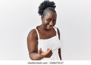 Young African Woman Standing Over White Isolated Background Beckoning Come Here Gesture With Hand Inviting Welcoming Happy And Smiling 