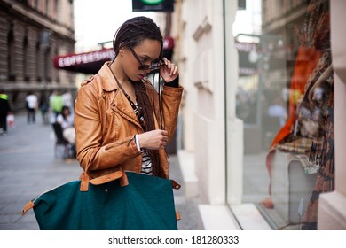 Young African Woman Window Shopping.