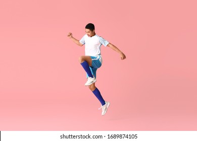 Young African-American football player on color background - Powered by Shutterstock