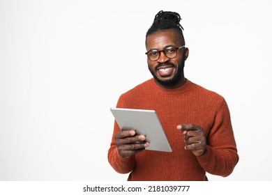 Young african-american man freelancer businessman using digital tablet online, e-learning, e-banking, surfing social media isolated in white background - Powered by Shutterstock