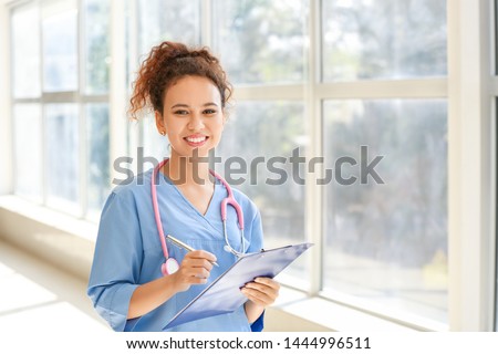 Young African-American nurse in clinic 商業照片 © 