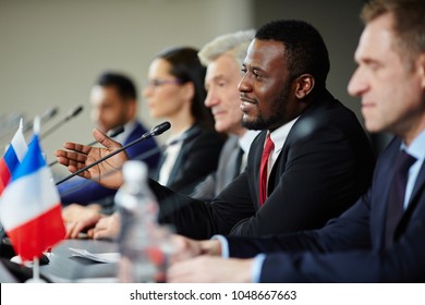 Young African-american politician explaining his opinion to audience during conference - Powered by Shutterstock