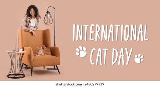 Young African-American woman and cat on armchair against beige background. Banner for International Cat Day - Powered by Shutterstock