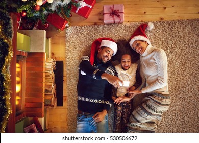 
Young Afro American Family Making Christmas Selfie