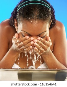 Young Afro American Woman Washing Her Face.