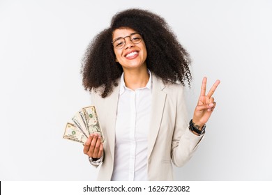 Young afro business woman holding a credit car isolated Young afro business woman holding a credit carshowing number two with fingers.