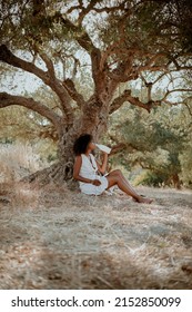 Young Afro Girl On Safari Nature Drink Milk In Sundress And Hat. Afro Hair, Ecology, Health, Milk Bottle, Brunette, Afro Hair, Relaxation, Tranquility, Farm Products