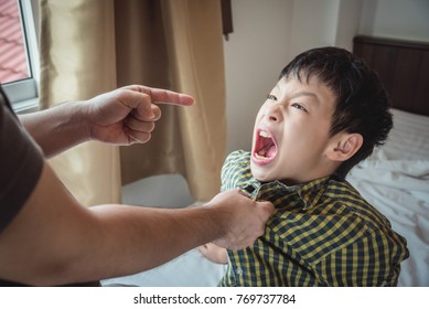 Young Aggressive Boy Yell To His Father After Punishment