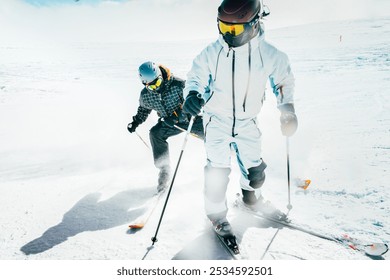 A young aggressive skier on an alpine slope demonstrates an extreme carving skiing style. He is skiing on morning perfectly groomed piste. - Powered by Shutterstock