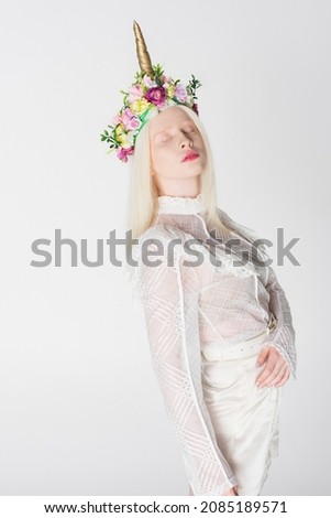 Similar – Happy blonde woman posing near a huge flower