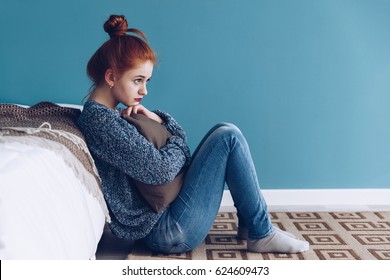 Young Alone Depressed Girl At Home