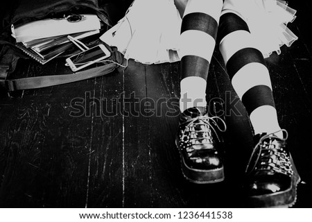 Young alternative girl with school bag - black and white image