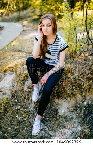 Similar – young girl standing near old building with wires