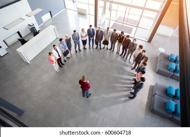 Young ambitious businessman hold meeting with employees, semicircle concept   - Powered by Shutterstock