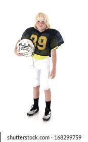 Young American football player standing holding helmet