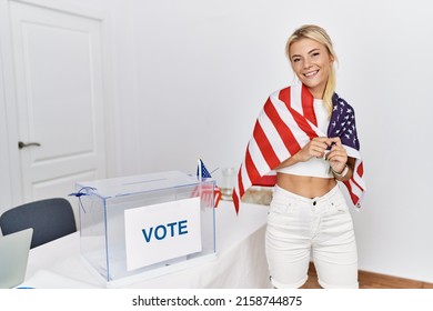 Young American Politic Party Worker Smiling Happy Wearing United States Flag At Electoral College.