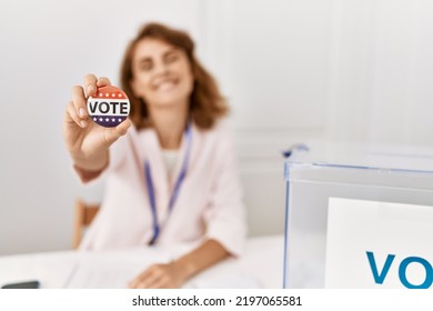 Young American Politic Party Worker Holding Vote Badge At Electoral College.