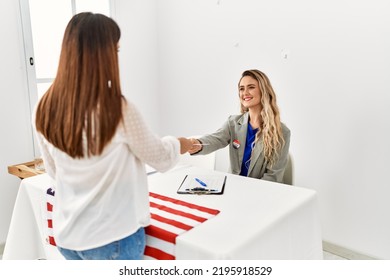 Young American Voter Woman Giving Party Vote To Electoral Table Worker.