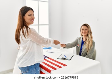 Young American Voter Woman Giving Party Vote To Electoral Table Worker.