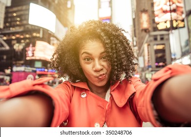 Young american woman taking selfie in New york, Time square - Powered by Shutterstock