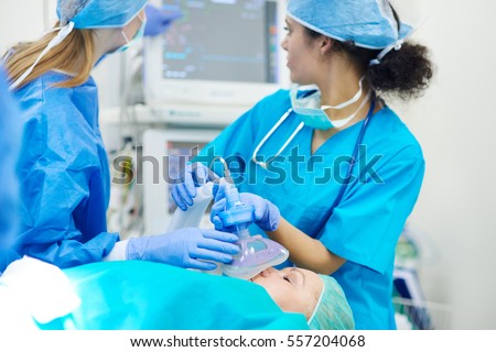 Young anesthesiologist at her work