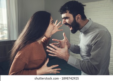 Young angry couple shouting at each other