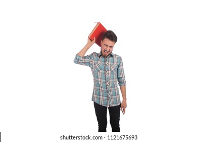 young angry man holding heavy book and screaming , isolated in white background