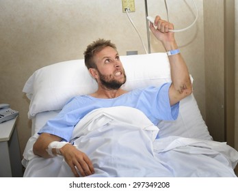 Young Angry Patient Man At Hospital Room Lying In Bed Pressing Nurse Call Button Feeling Nervous And Upset In Some Kind Of Emergency Health Care And Medical Attention Concept