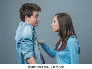 Young angry woman arguing with his boyfriend and pointing at him