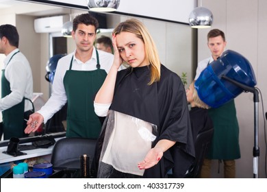 Young Angry Woman Blaming Hairdresser In Bad Haircut 