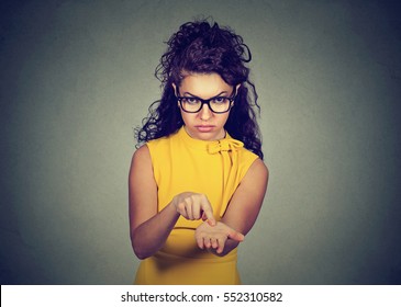 Young angry woman in yellow dress asking for more money, pay back debt