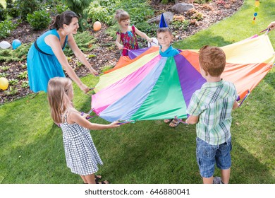 Young Animator Making Up Games For Kids On A Party