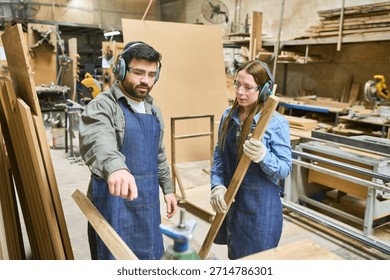 A young apprentice learns from an experienced mentor in a lively workshop environment, emphasizing teamwork and skill development in woodworking. The scene captures hands-on training and intergenerational collaboration. - Powered by Shutterstock - Get 15% off with code: PIKWIZARD15
