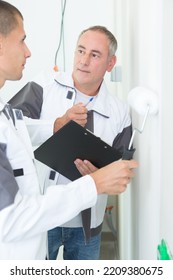 Young Apprentice Plumber With Clipboard Indoors