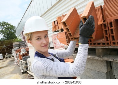 Young Apprentice Working On Construction Site