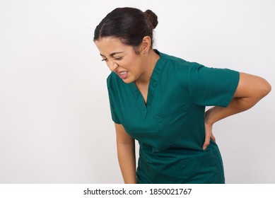 Young Arab Doctor Surgeon Woman Over Isolated White Background Suffering Of Backache, Touching Back With Hand, Muscular Pain