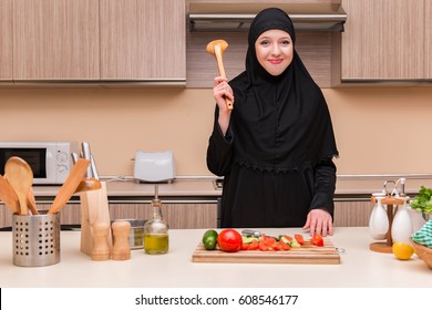 Young Arab Family In The Kitchen