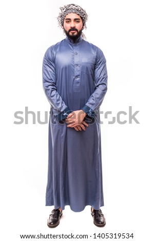 Young arab handsome man wearing in traditional abaya clothes isolated on white background