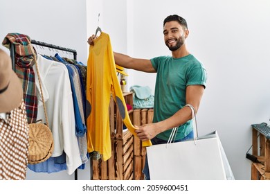 Young Arab Man Customer Smiling Confident Shopping At Clothing Store