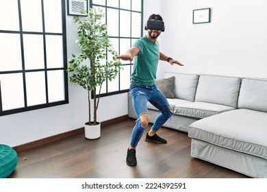 Young Arab Man Smiling Confident Playing With Vr Goggles At Home