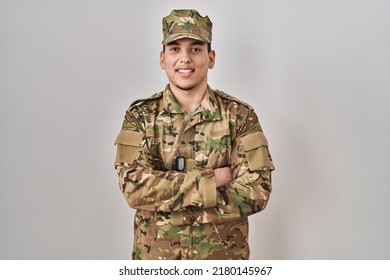 Young Arab Man Wearing Camouflage Army Uniform Happy Face Smiling With Crossed Arms Looking At The Camera. Positive Person. 