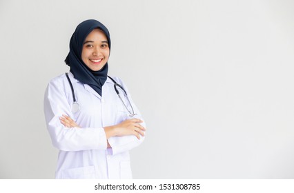 Young Arab Muslim Headscarf Doctor Women Smile On Isolated White Background Concept Islam People Working In Medical Hospital Health Care, Modern Nurse Wearing Hijab In Medico Clinic Pharmacist Shop.